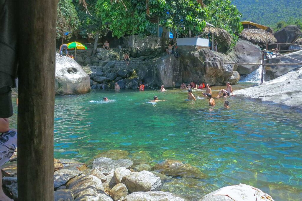 Locals swimming in the water of Elephant Springs (Suoi Voi)