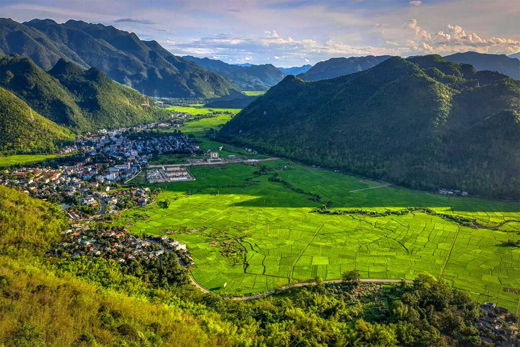 Stunning views over Mai Chau valley with green rice fields and villages seen from Mai Chau Viewpoint on Thung Khe Pass
