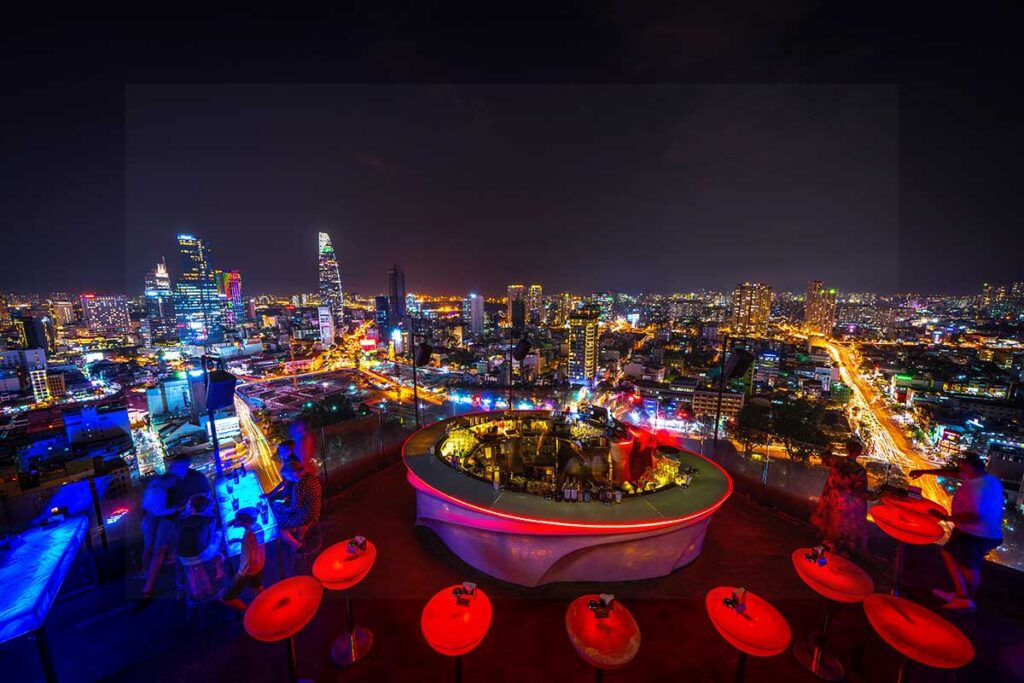 Nightscape of Ho Chi Minh City and rooftop bar.