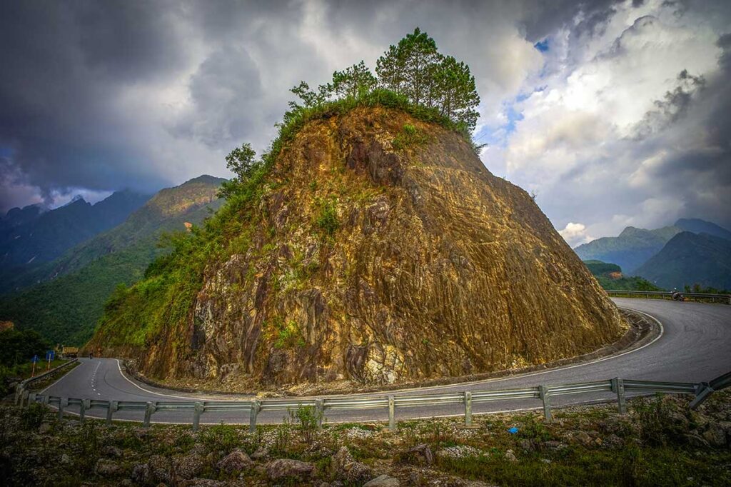 Road of Tram Ton Pass winding along a rocky mountain