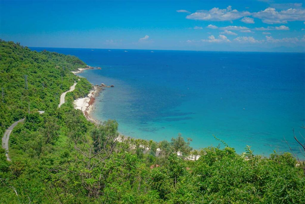 Scenic Bai Chong Beach on Cham Island, the island’s main tourist beach with clear water and soft sand.