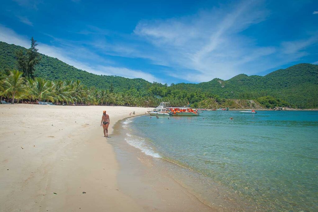 Peaceful Bai Bim Beach on Cham Island, known for clear water and excellent snorkeling right from the shore.