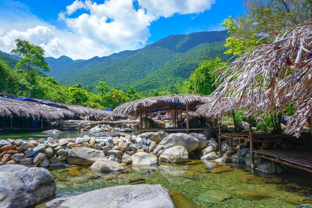 A small stream with bamboo huts on the side part of Elephant Springs (Suoi Voi) in Hue