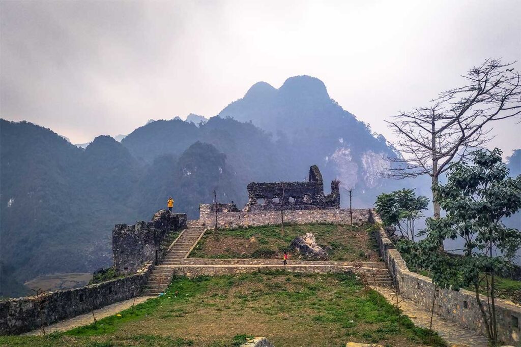 The ruins of French fort with mountains all around it along the Ha Giang Loop