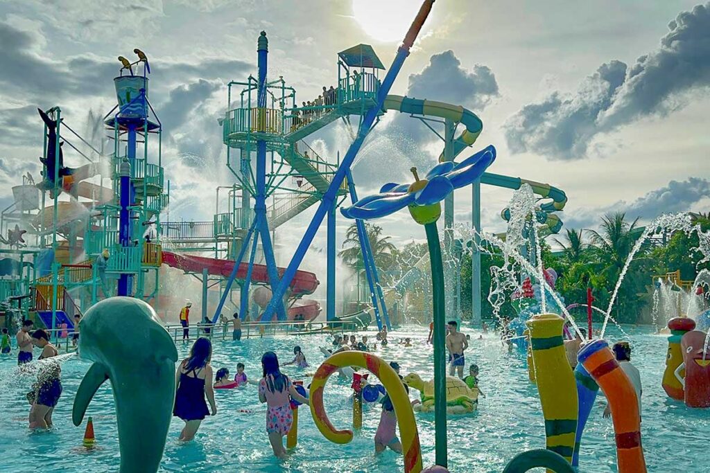 Hoi An with kids – enjoying the water park at VinWonders Nam Hoi An with colorful slides and splash zones