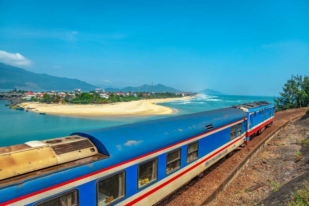 The train passes by the Hai Van Pass with the view in the background of Lang Co Beach