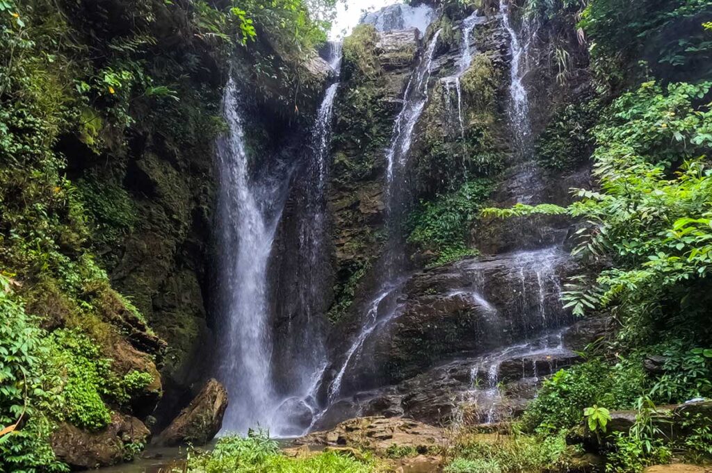 The small and hidden Nai Dam Dam Waterfall in Nam Dam Village, along the Ha Giang Loop