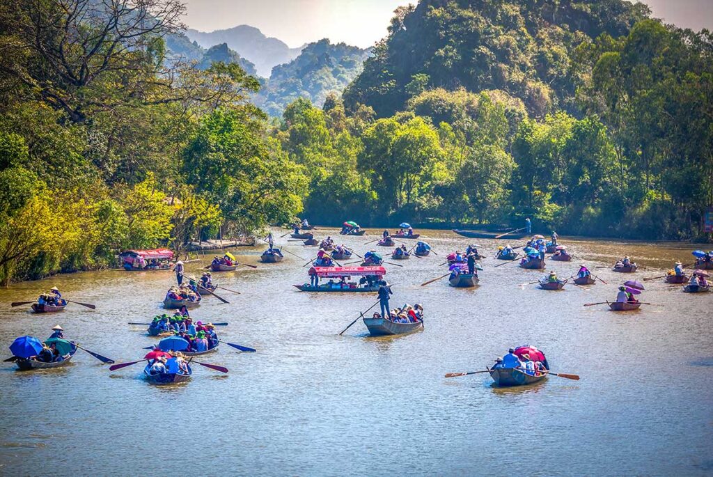 Many rowing boats on the Yen River during Perfume Pagoda Festival