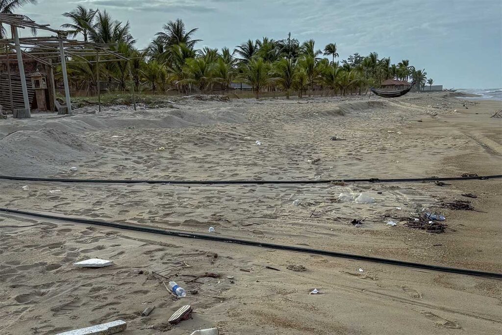 Litter on Thuan An Beach in December after winds and rough seas wash the pollution on the beach