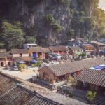 Bird's eye view of Dong Van Old Quarter, showcasing the tiled roofs of historic houses.