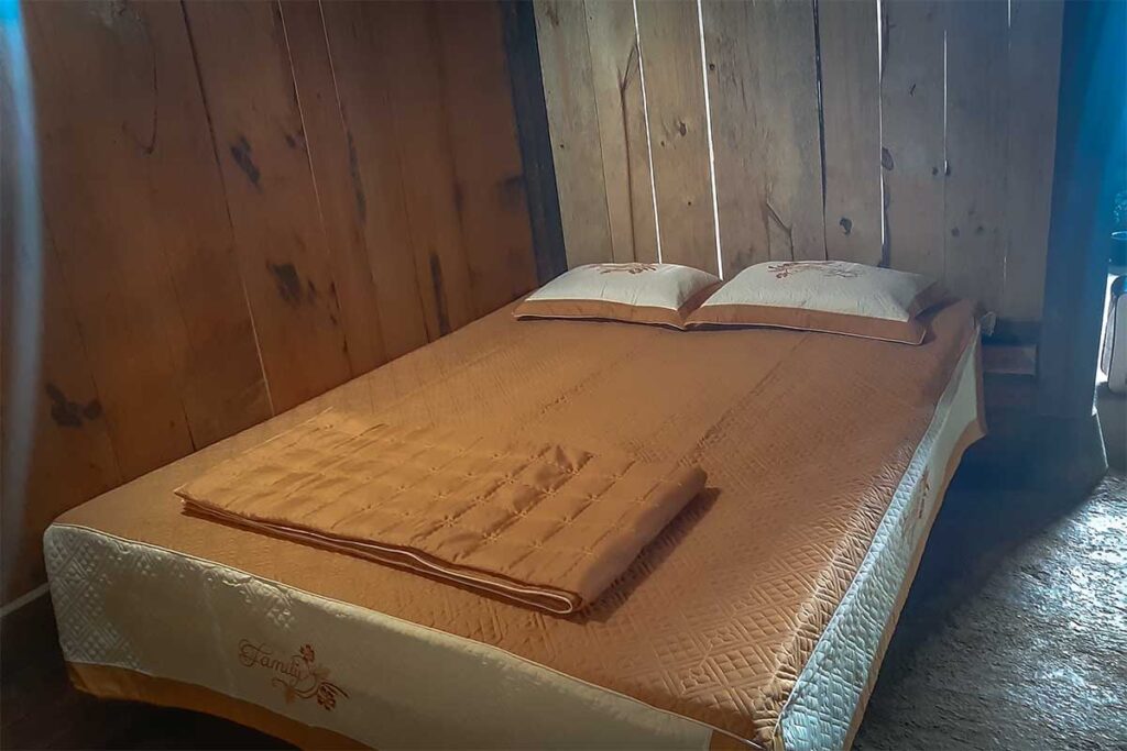 Very basic room with double bed of Indigenous Homestay in Mu Cang Chai