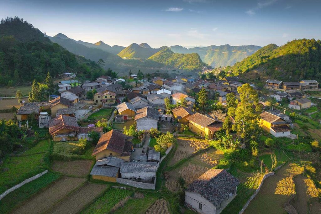 Aerial view of Lo Lo Chai Village – A traditional village with beautiful yellow clay houses of the Lo Lo ethnic group, surrounded by Ha Giang’s rugged mountains.