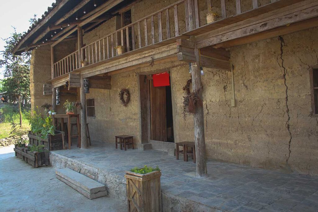 Traditional Lo Lo clay house – A well-preserved Lo Lo ethnic house in Lo Lo Chai Village, built using yellow clay and wooden beams, reflecting the region’s unique architecture.