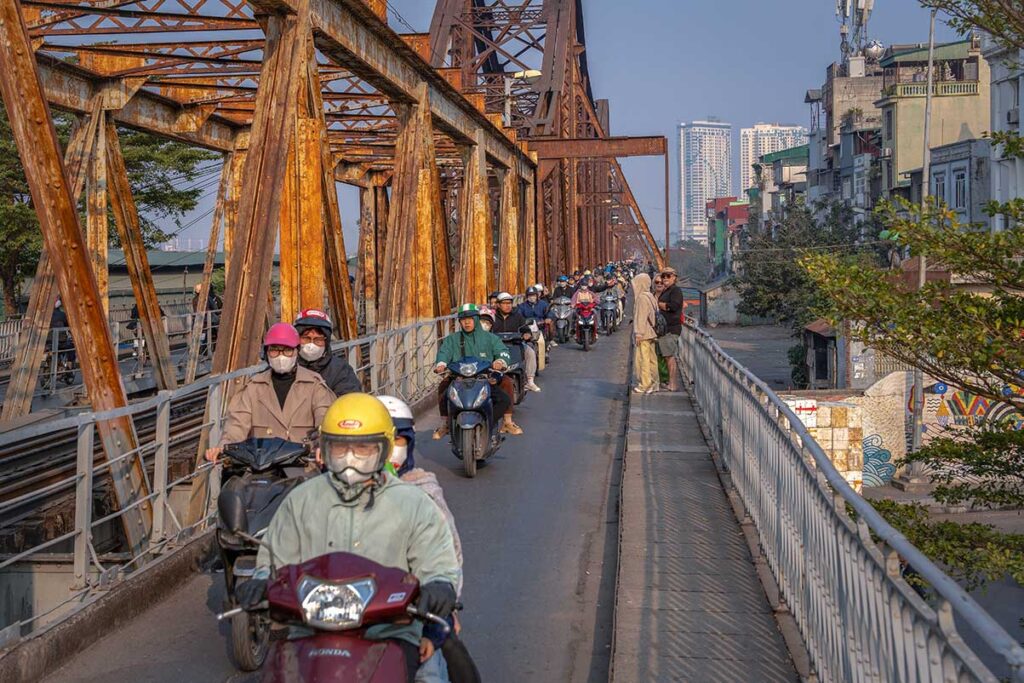 Traffic of scooters driving on the Long Bien Bridge of Hanoi