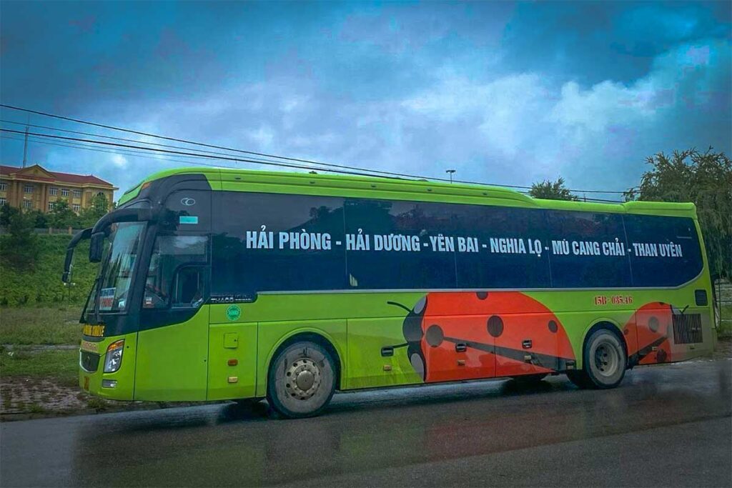 A green sleeper bus that drivers from Hanoi to Mu Cang Chai