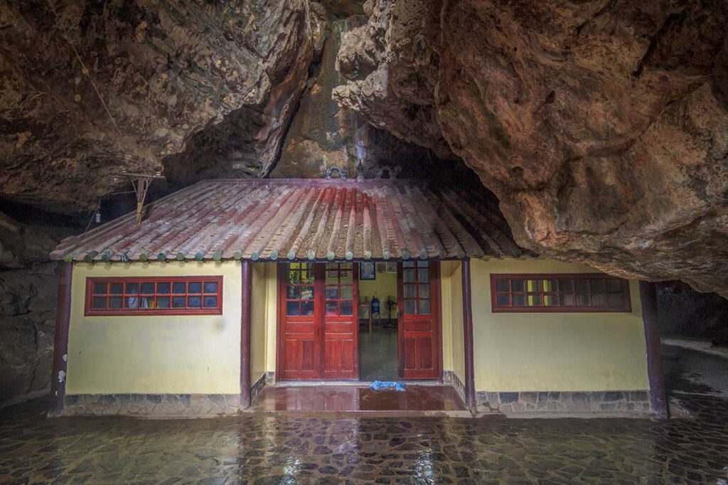 Temple building nestled inside Thach Dong Cave, one of the most visited cave temples in Ha Tien.