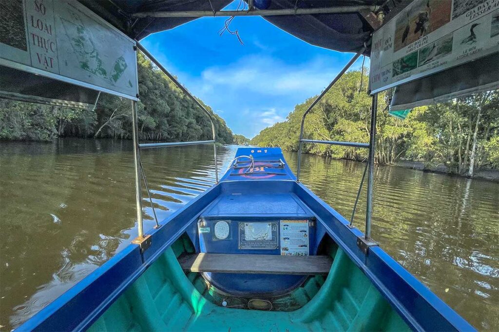 A boat tour on a canal through Tram Chim National Park