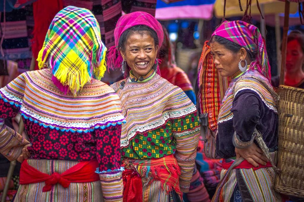 Flower Hmong woman in colorful traditional dresses at Bac Ha Market