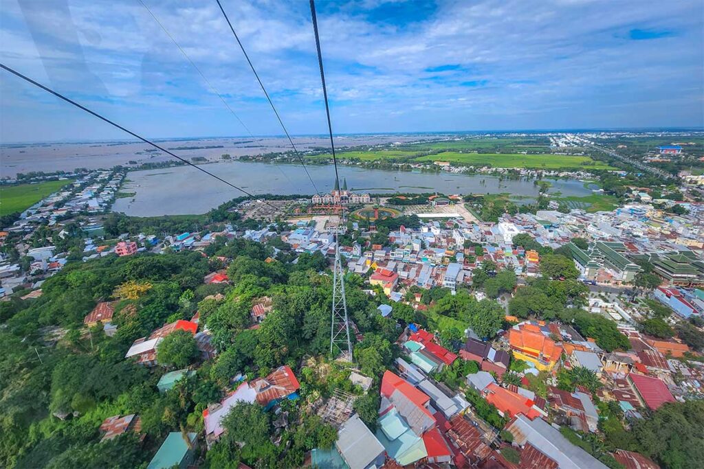 View from Sam Mountain cable car looking over Chau Doc town, rice fields, and waterways of the Mekong Delta.