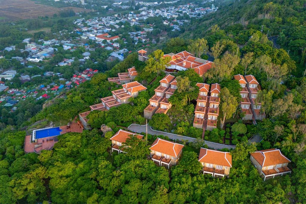 Aerial view of Victoria Nui Sam Lodge on Sam Mountain, surrounded by greenery with panoramic views of Chau Doc.