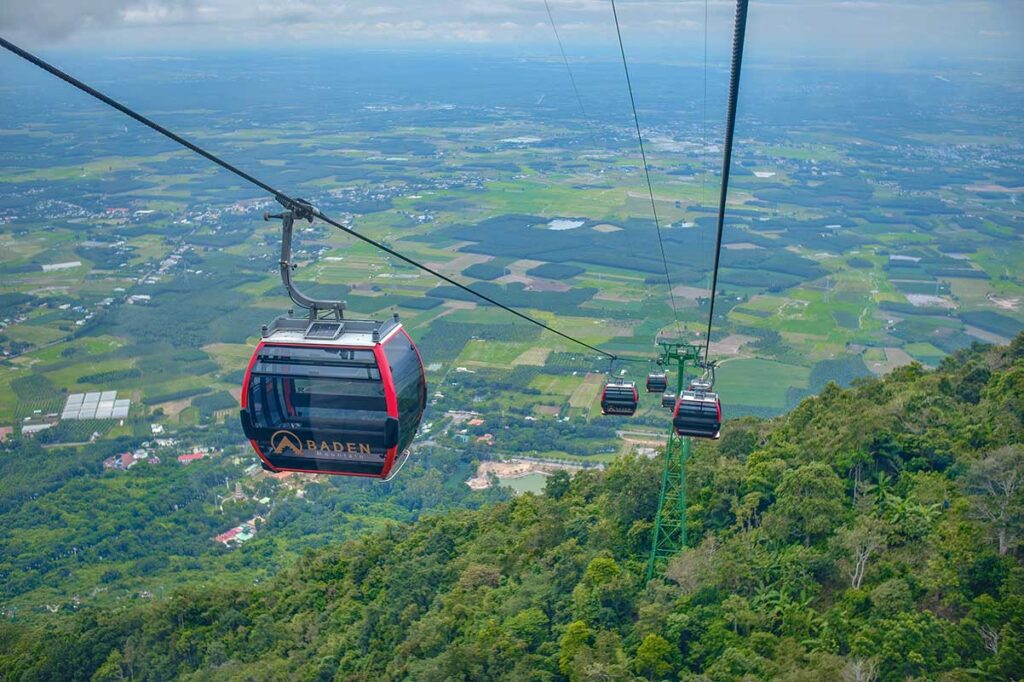 The cable car flying over the forests to the top of Black Virgin Mountain