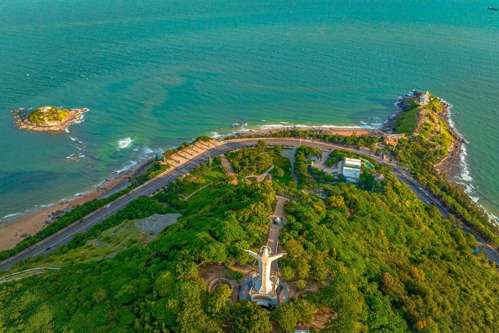 High aerial view of Hon Ba Island, statue of Christ Vung Tau and Nghinh Phong Cape