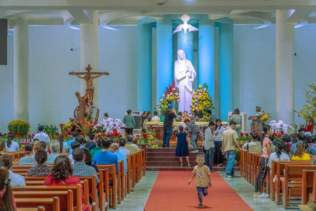 A mass is being held inside the church part of Nui Cui Pilgrimage Center