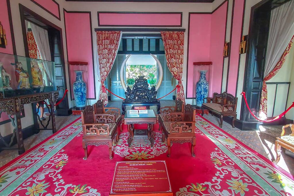 Antique furniture in a room within Bach Dinh Palace
