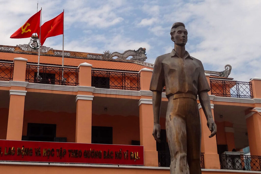 A statue of Ho Chi Minh as a young man, known as Nguyen Tat Thanh in front of Dragon Wharf in Ho Chi Minh City