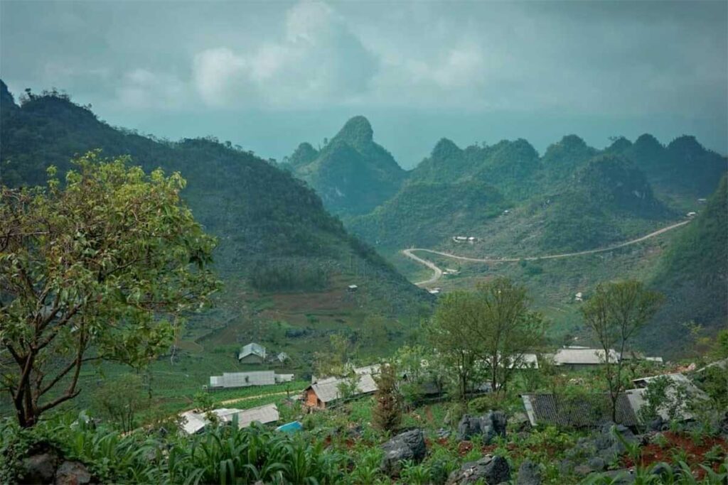 Remote mountain valley in Sủng Trái, Ha Giang, where Local Vietnam began construction of its first lodge, showing authentic rural scenery and karst peaks.