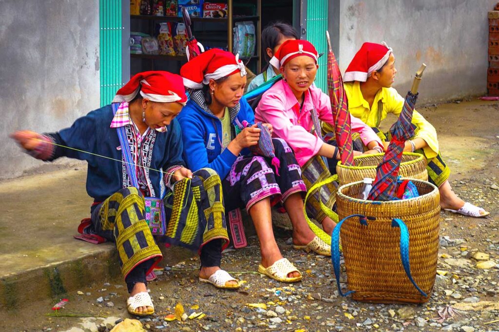 Red Dao woman with colorful red headscarf