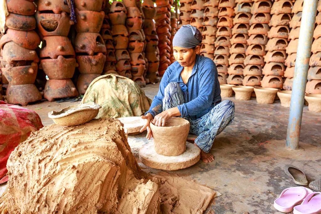 woman making a pot at Bat Trang Ceramic Village