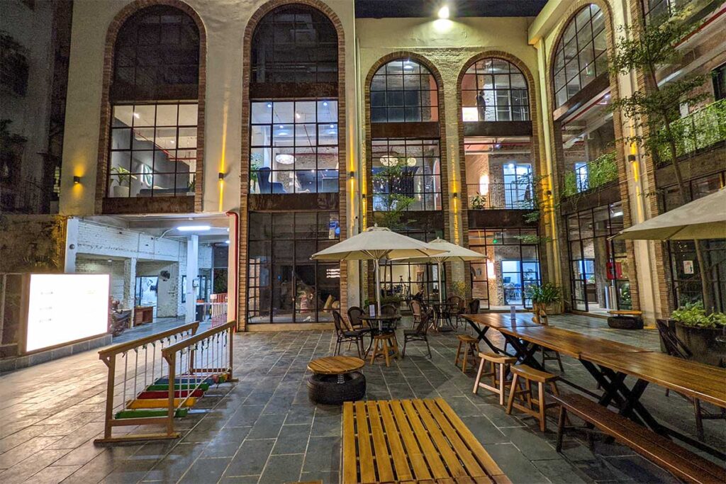 Complex 01 Urban Cafe: Industrial-chic vibes meet outdoor seating at Complex 01, a trendy urban cafe in Hanoi's factory complex, perfect for Instagram photos.