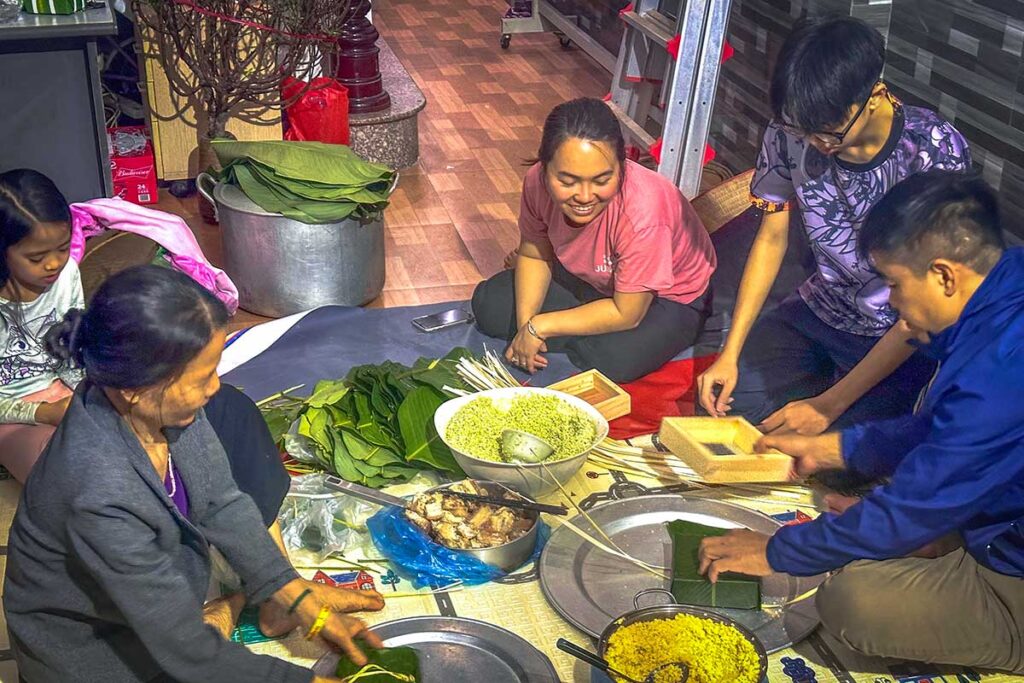 Local Family Dinner Preparation: A Vietnamese family prepares a traditional dinner in their Hanoi home, showcasing the warmth and hospitality of local culture.