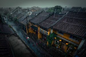 Rainy day in Hoi An ancient town, showcasing the charm of wet streets during Vietnam's rainy season.