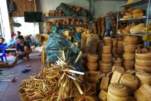A warehouse overflows with handcrafted bamboo baskets and other items in Phu Vinh Bamboo Village.