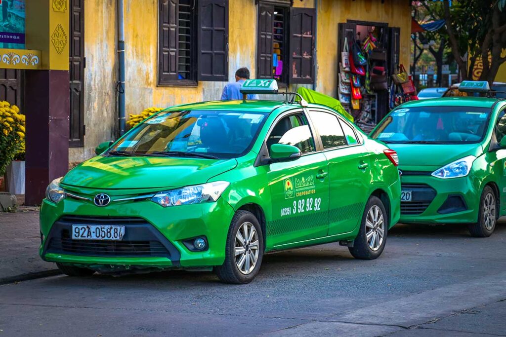 The green Mai Linh taxi in Vietnam parked on the street