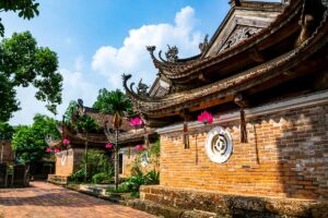 Tay Phuong Pagoda Exterior: The elaborate double-tiered roofs and intricate carvings of Tay Phuong Pagoda near Hanoi showcase traditional Vietnamese architecture.