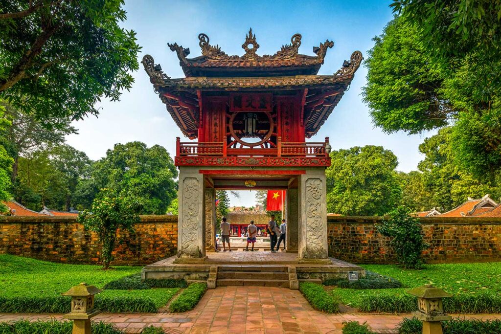 Temple of Literature Gate with Roof: The beautifully tiled and carved roof of a gate at the Temple of Literature in Hanoi showcases intricate craftsmanship.