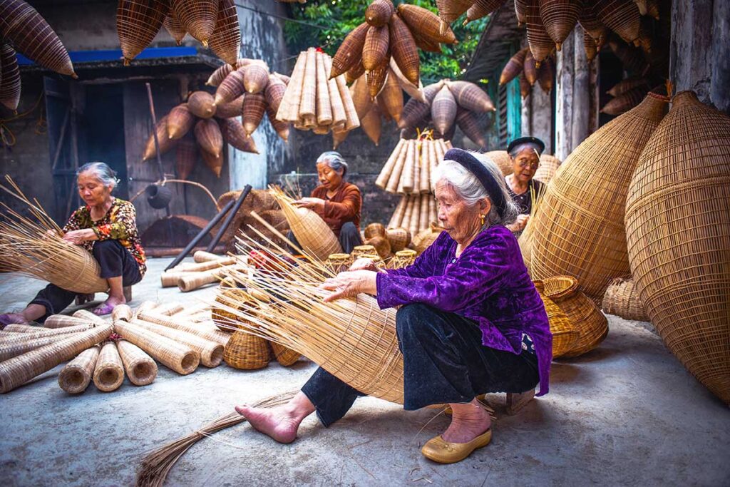 woman crafting fish traps at Thu Sy Village