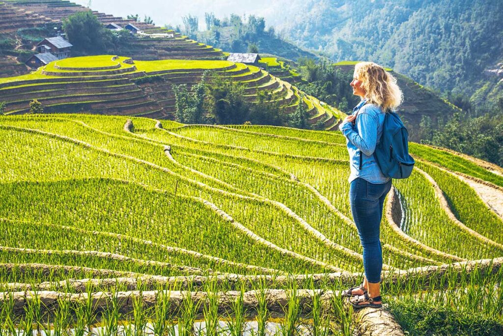 foreign woman making  a trekking in Sapa through Muong Hoa Valley