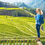 foreign woman making a trekking in Sapa through Muong Hoa Valley