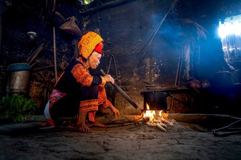 A ethnic woman cooking on an open fire at Ai Quoc Commune in Lang Son