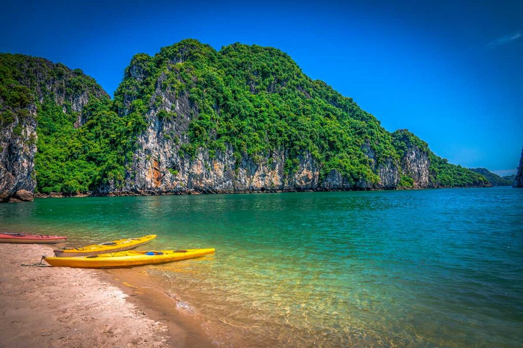 A beach in Bai Tu Long Bay with 2 kayaks