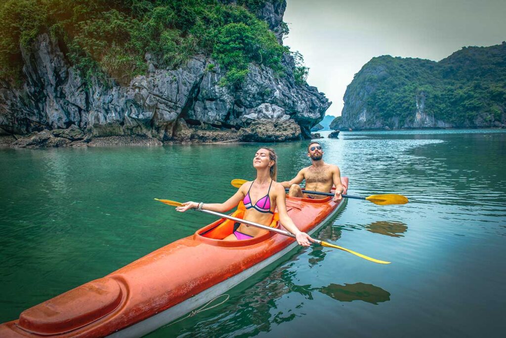 A couple kayaking together in Halong Bay