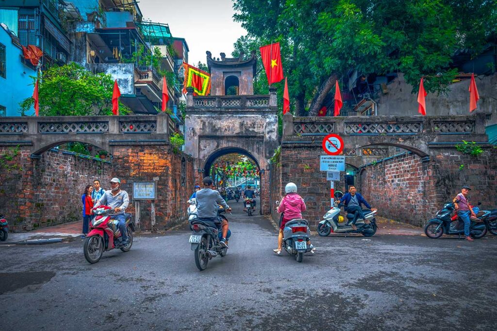 The Hanoi Old City Gate (quan chuong ) were motorbikes are driving through it