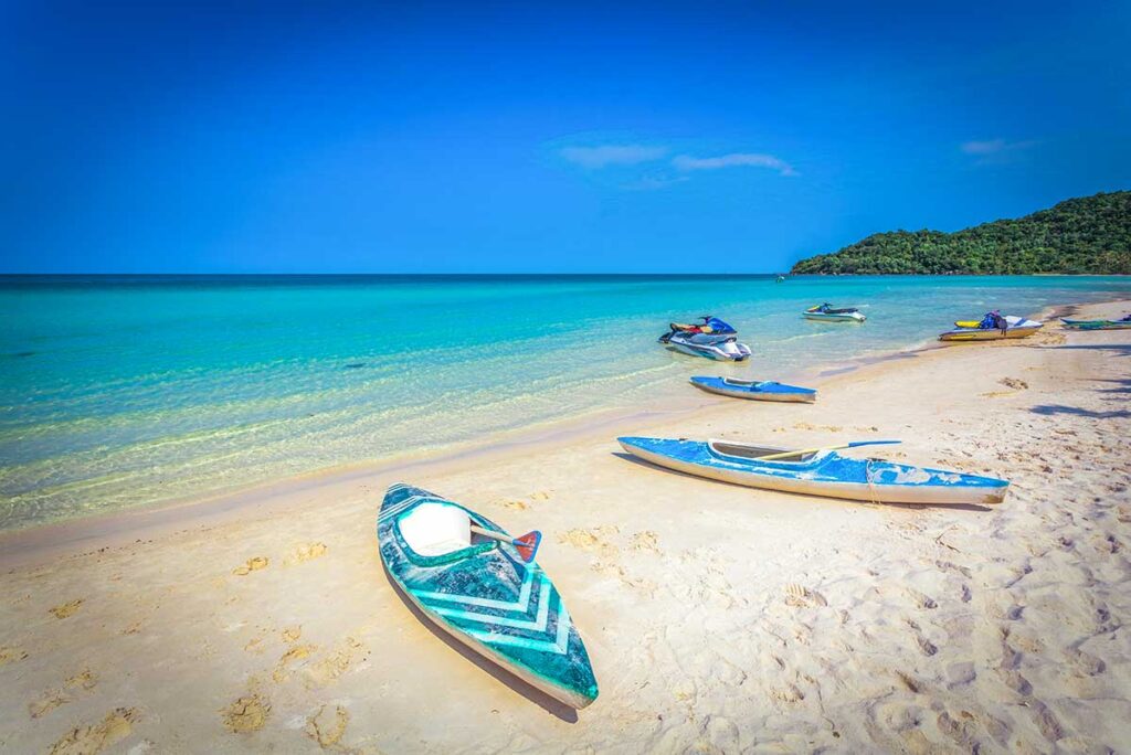 Kayaks laying on a stunning white sandy beach in Phu Quoc