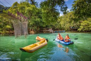 Kayaks on the blue water of Mooc Spring in Phong Nha