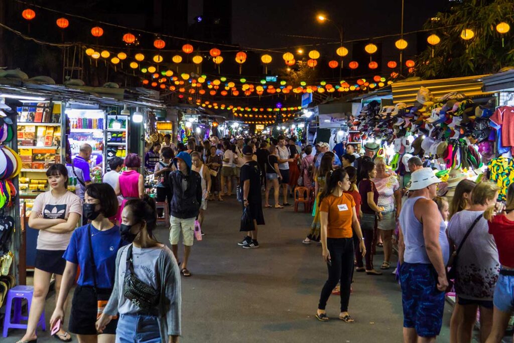 Tourists and locals walking through the Night Market in Nha Trang