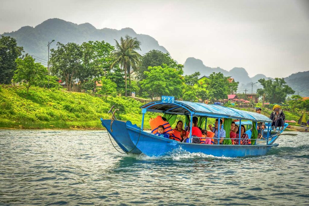 Boat tour from Son Trach Town through the countryside and jungle of Phong Na National Park over the river that leads to the entrance of Phong Nha Cave